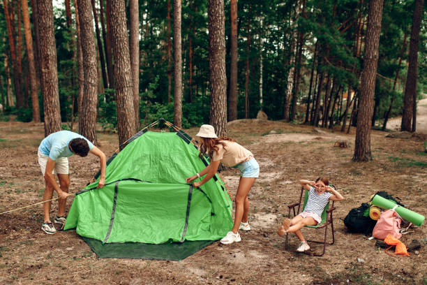 istock Family with dog in the forest 1347924634
