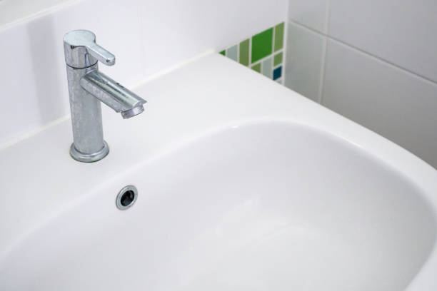 istock white sink and faucet bathroom interior 1347926924