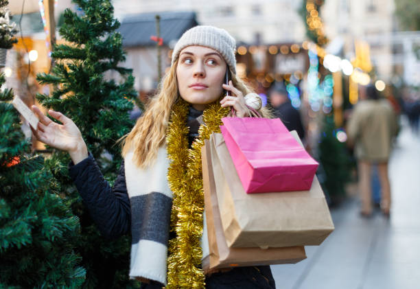 istock Girl choosing Christmas tree 1347929035