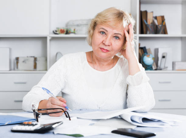 istock Woman engaged in home accounting 1347929460