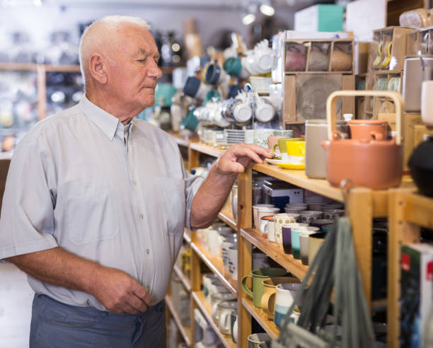 istock Senior man choosing variety goods for kitchen 1347930606