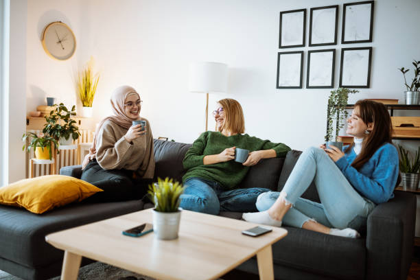 istock Diverse girlfriends enjoying friendship at home, sharing secrets 1347933535