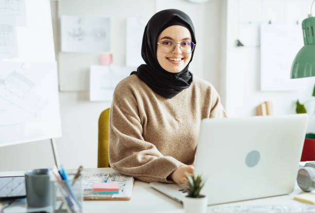 istock Middle Eastern woman working in office on laptop 1347933683