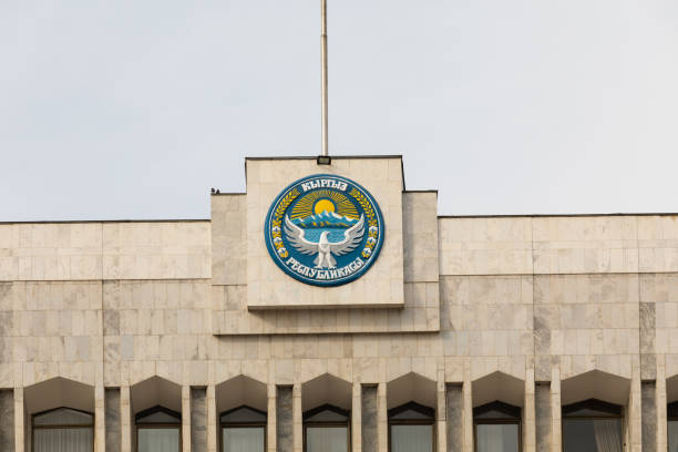 istock Kyrgyzstan flag waving on a flagpole with islamic star and crescent elements 1347937362