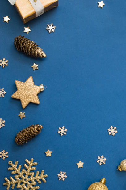 istock Christmas holiday composition. Flat lay frame with christmas balls and gift box on a blue background 1347938466