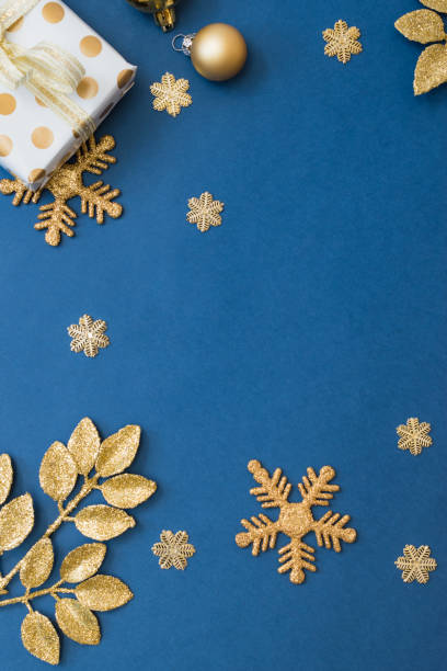 istock Christmas holiday composition. Flat lay frame with christmas balls and gift box on a blue background 1347938471