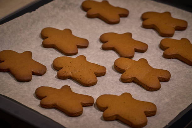 istock gingerbread men on the baking tray warming up 1347940479