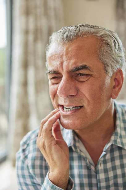 istock Mature Man At Home Suffering From Pain With Toothache 1347942559