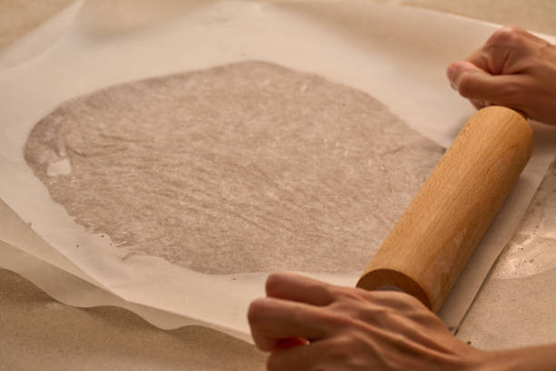 istock kneading with rolling pin the dough for gingerbread man preparation 1347944326