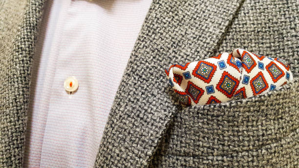 istock Gray wool jacket over a light red buttoned shirt and a matching red silk pocket square 1347944744