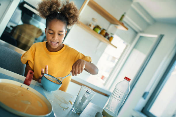 istock Little girl playing in the kitchen. 1347948518
