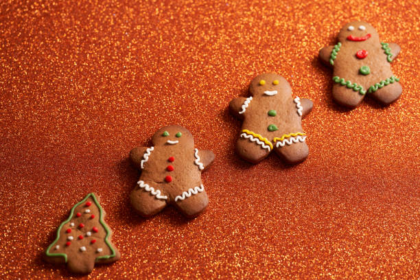 istock gingerbread man on bright orange christmas background with space 1347948561