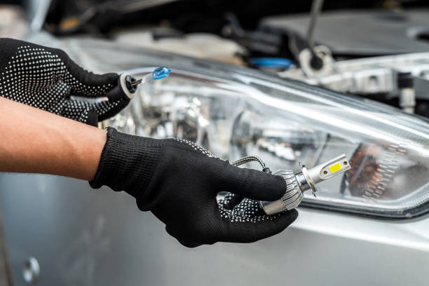 istock The mechanic chooses between light bulbs 1347948968