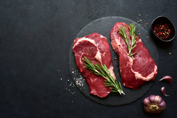istock Raw organic rib eye steak with ingredients for making 1347958137