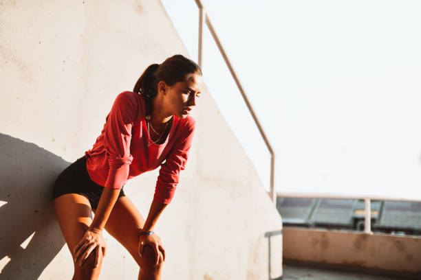 istock Tired Female Athlete Taking A Break On Grandstand 1347971925