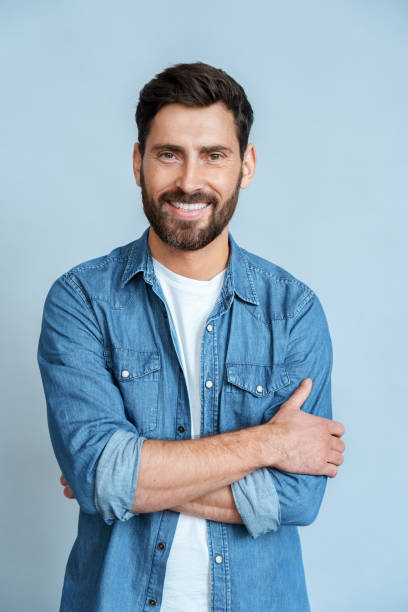istock Portrait happy smiling man in casual clothes isolated on blue wall background 1347972702