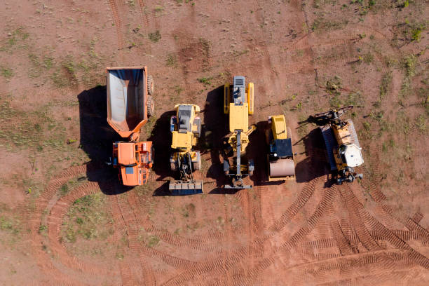 Construction machinery, clay mine for the production of bricks and building materials viewed from directly above.