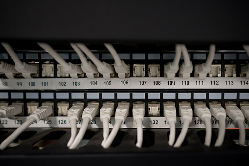 Close up of rack mounted networking equipment. Selective focus.