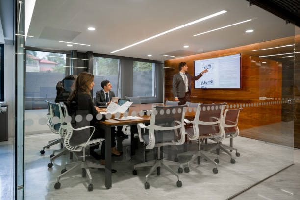 istock Business man making a presentation to his team in a meeting 1347972987