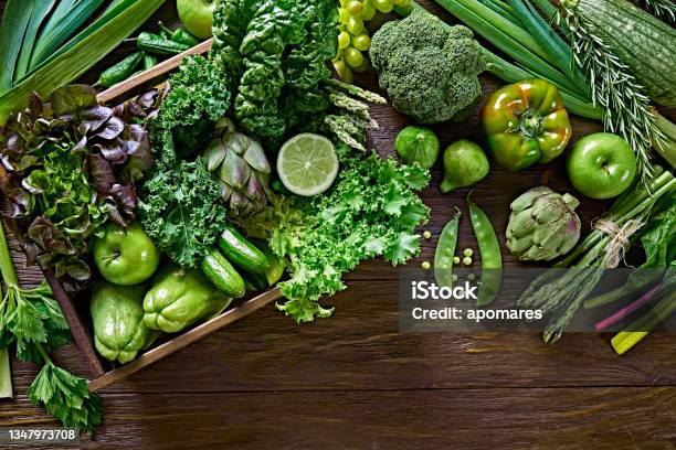 Table Top View Background Of A Variation Green Vegetables For Detox And Alkaline Diet Set In A Crate On A Wooden Rustic Table Stock Photo - Download Image Now