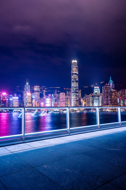 istock Empty brick platform with Hong Kong skyline in background at night 1347976429