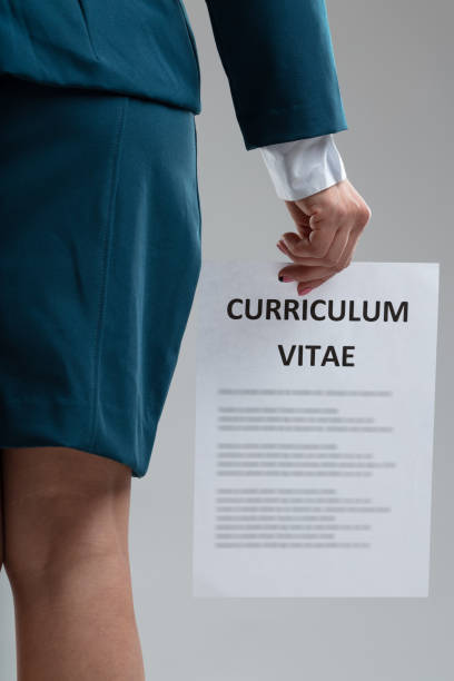 istock Job applicant holding her Curriculum Vitae dangling from a hand 1347976524