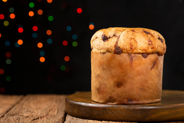 istock Delicious panettone with chocolate chips on a table decorated for Christmas. 1347978264
