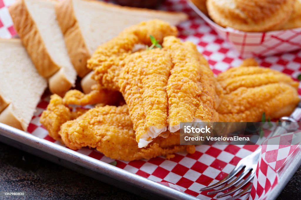 Southern fried fish with toast Southern fried fish with toast, buttermilk breaded cod or catfish Fried Stock Photo