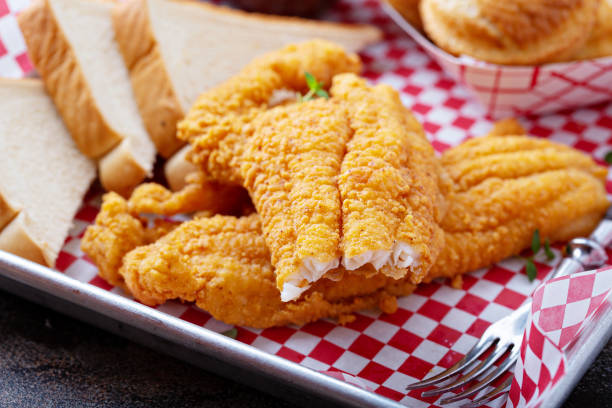 Southern fried fish with toast Southern fried fish with toast, buttermilk breaded cod or catfish breaded photos stock pictures, royalty-free photos & images