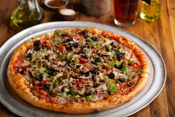 istock Vegetarian pizza with vegetables and mushrooms 1347984670