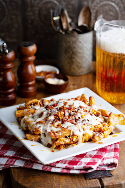 istock Cheese fries topped with bacon 1347984707