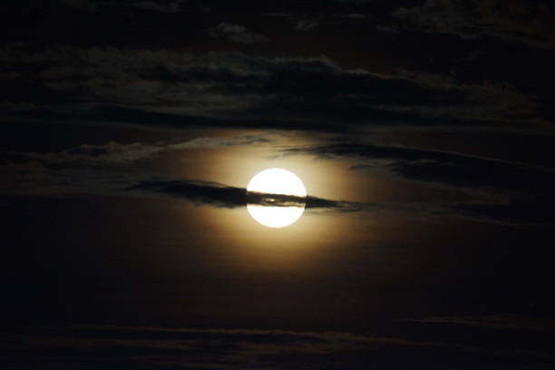 istock Hunter's moon in full glory with clouds in between 1347986090