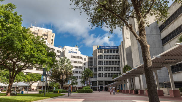 Jackson Health System Miami, USA - October 21, 2021: View of Jackson Memorial Hospital facilities in a sunny morning. Jackson Health System in Miami, Florida is a nonprofit academic medical system governed by the Public Health Trust which ensures that all residents of Miami-Dade County receive a single high standard of care regardless of their ability to pay. support usa florida politics stock pictures, royalty-free photos & images