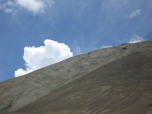 Leh - Cloud Behind a Mountain stock photo