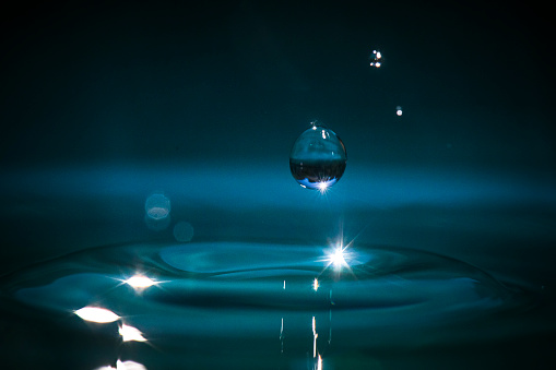 Simple droplets onto clean blue water