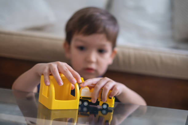 Little Boy Plays Toy Truck