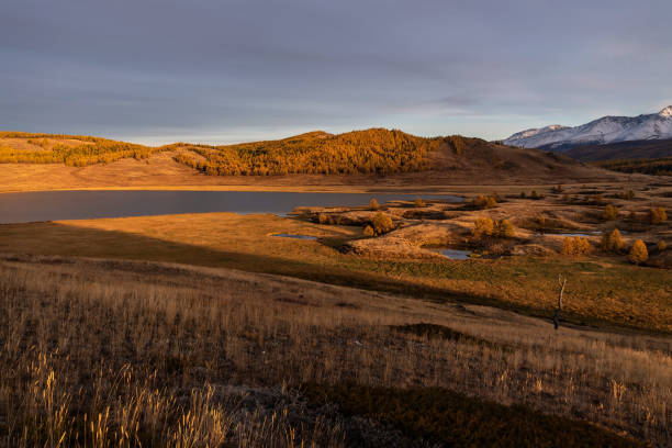 istock mountains lake trees sunset autumn hills 1347999331