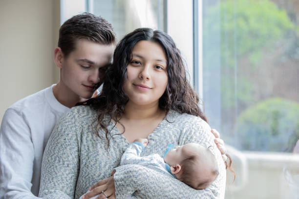 Young Parents with Newborn baby at hospital stock photo
