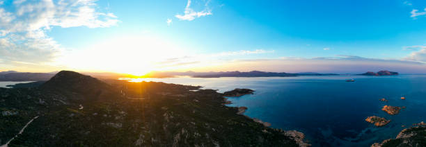 istock View from above, aerial shot, panoramic view of a coastline during a dramatic sunset. Capo Ceraso, Sardinia, Italy. 1348002649