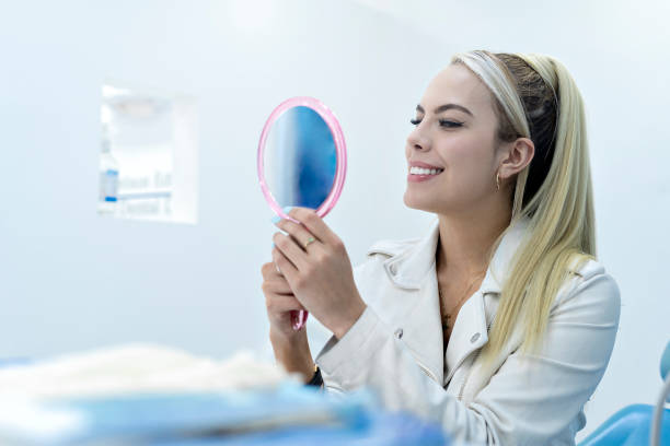 istock Satisfied patient at the dentist 1348002802