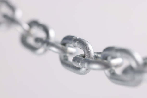 istock Chromed metal chain links in air closeup 1348004600