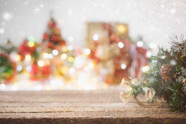 istock Wooden table and christmas lights background 1348005420