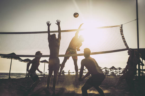 istock Young friends having fun while playing beach volleyball. 1348014550