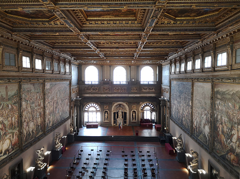 View of the Salone dei Cinquecento, the most imposing chamber in Palazzo Vecchio, with a length of 52 m and width of 23 m. It was built in 1494 by Simone del Pollaiolo, on commission of Savonarola.\nFlorence, Tuscany.