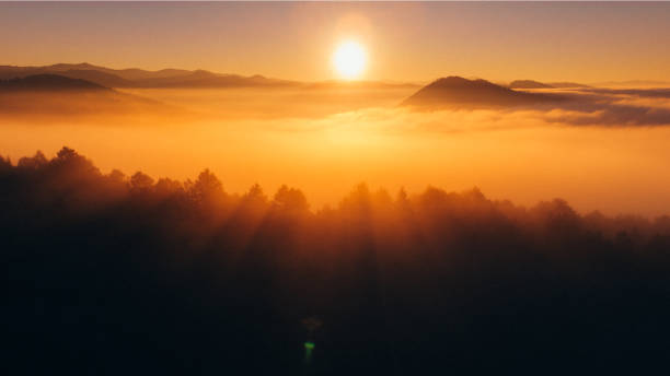 istock A beautiful sunrise over a foggy mountain 1348015635