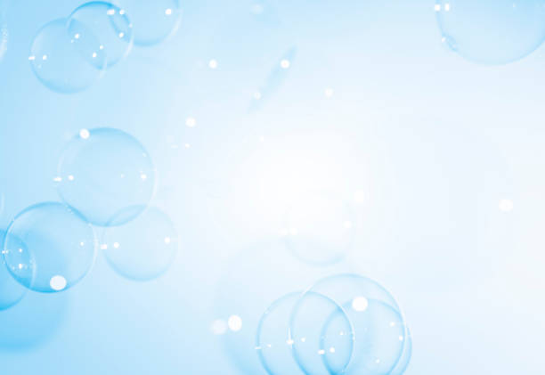 Beautiful Transparent Blue Soap Bubbles on White Background
