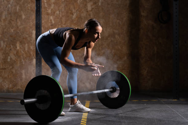 istock Woman with barbell 1348021198