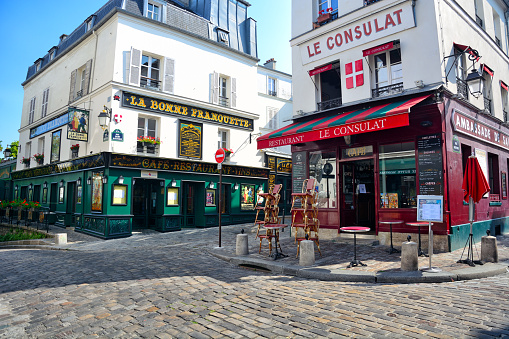 Exterior of the famous cafe Le Consulat in Montmartre, Paris. The cafe was visited by plenty of the acclaimed artists, writers and painters that flocked to the area in the 19th century, include Picasso, Sisley, Van Gogh, Toulouse-Lautrec and Monet