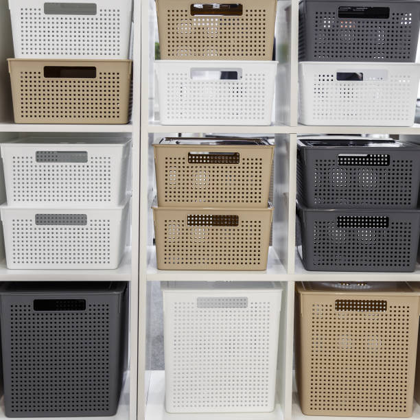 istock Plastic container boxes on a shelf on a rack for organizing home space, order and interior, sale of household goods. Industrial background. 1348023998