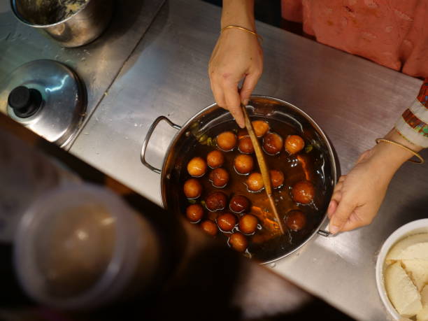 istock indian sweets boiling in sweet syrup 1348026379